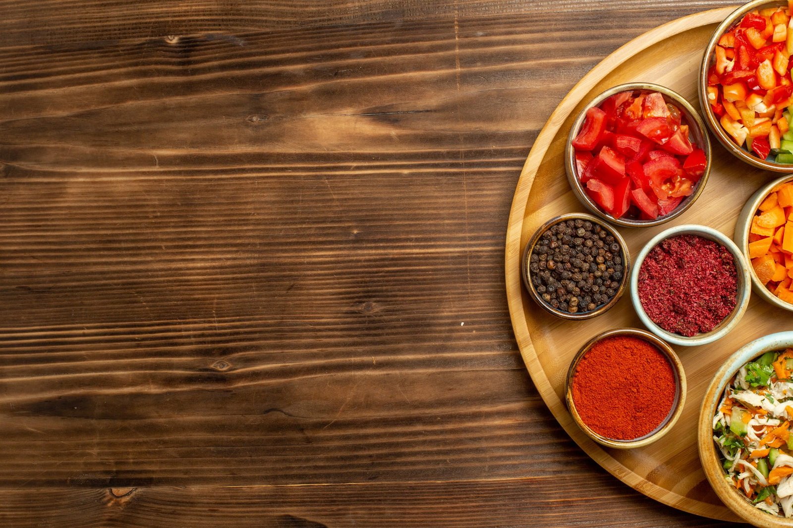 10 essential spices for a traditional kitchen displayed in bowls