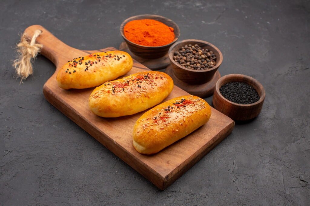 Assorted regional Indian breads arranged on a wooden board